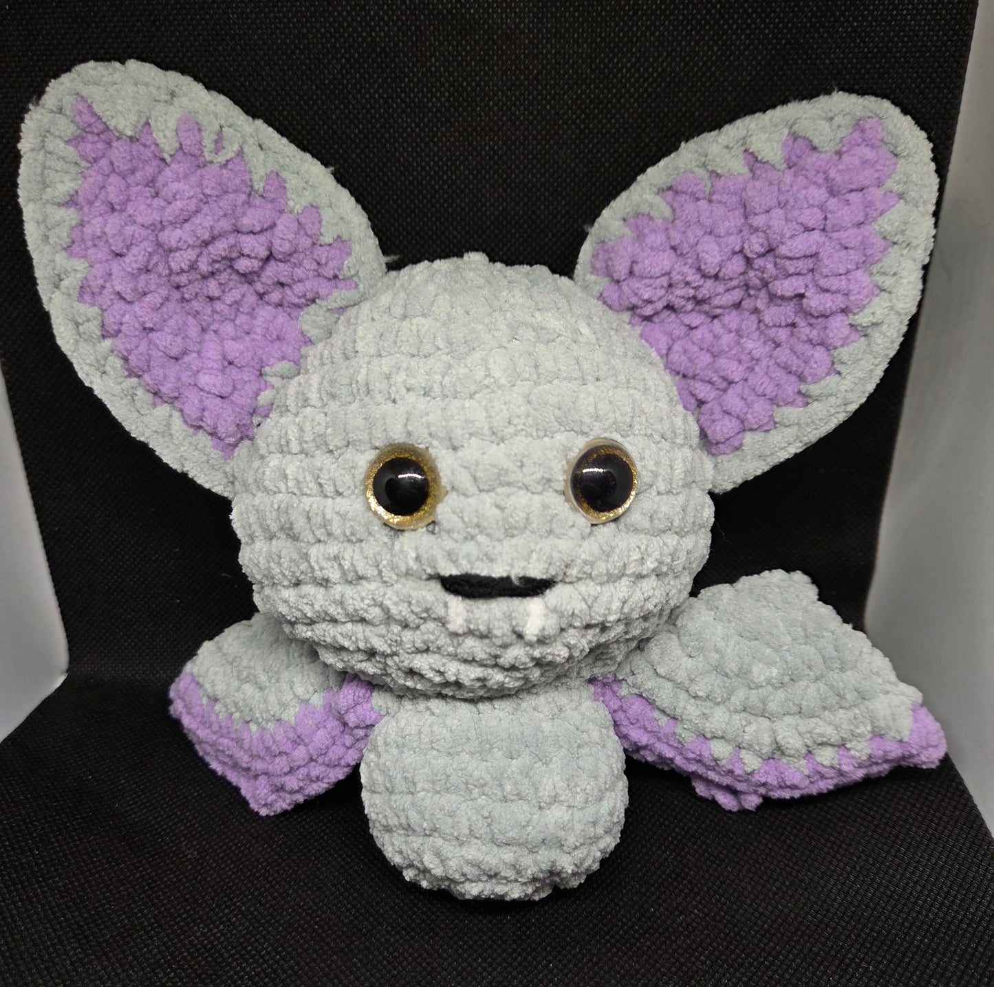 Gray and purple bat