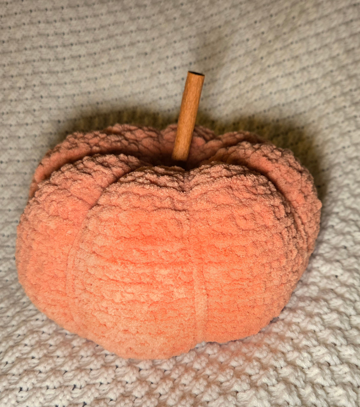 Pumpkin plushie with cinnamon stick stem
