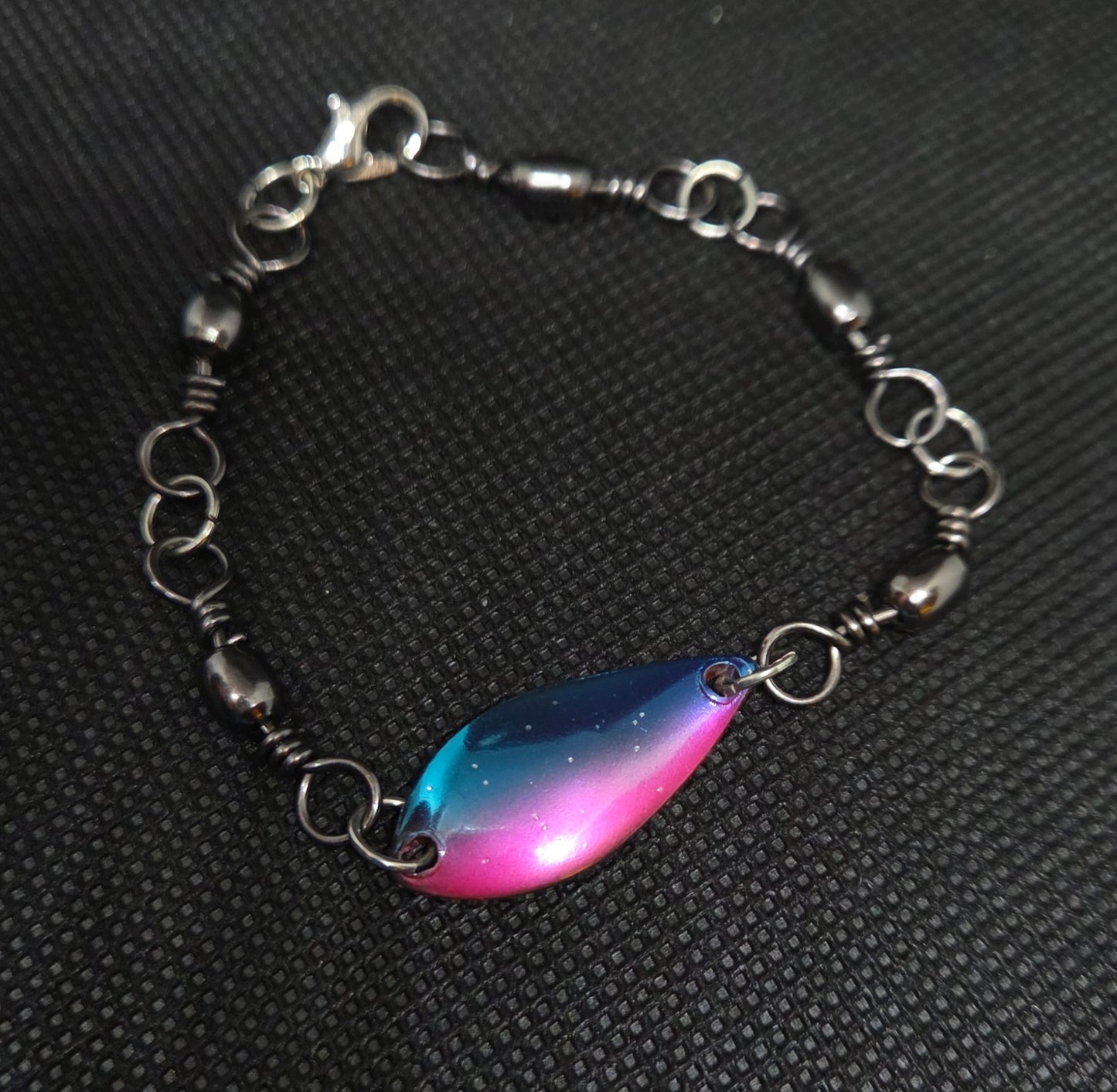 Fishing swivel bracelet with blue and pink spoon lure