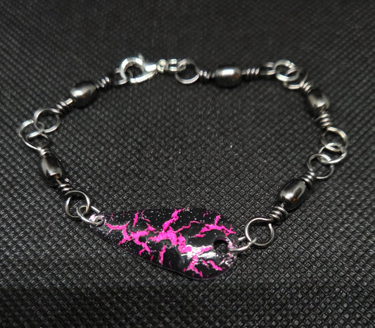 Fishing swivel bracelet with pink and black spoon lure