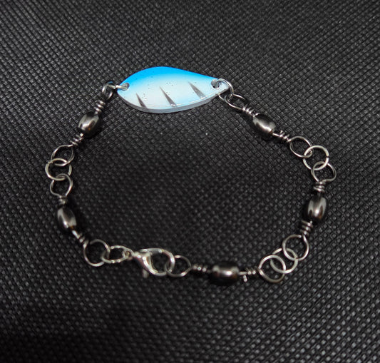 Fishing swivel bracelet with blue and white spoon lure