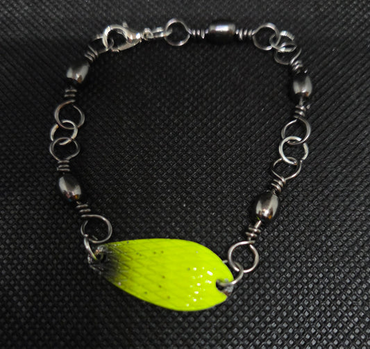 Fishing swivel bracelet with yellow and black spoon lure