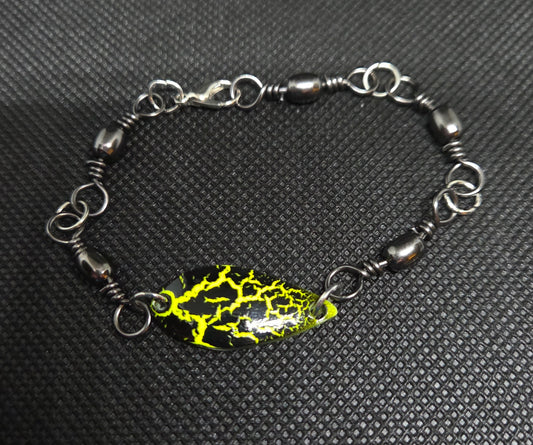 Fishing swivel bracelet with yellow and black spoon lure